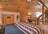 The loft queen bedroom offers a peaceful retreat, complete with a desk and chair.
