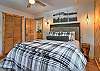 Relax and recharge in this cozy queen bedroom retreat.