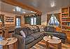 The downstairs area is complete with billiards, ping pong, a puzzle table, big screen TV, and popcorn machine for movie night. 