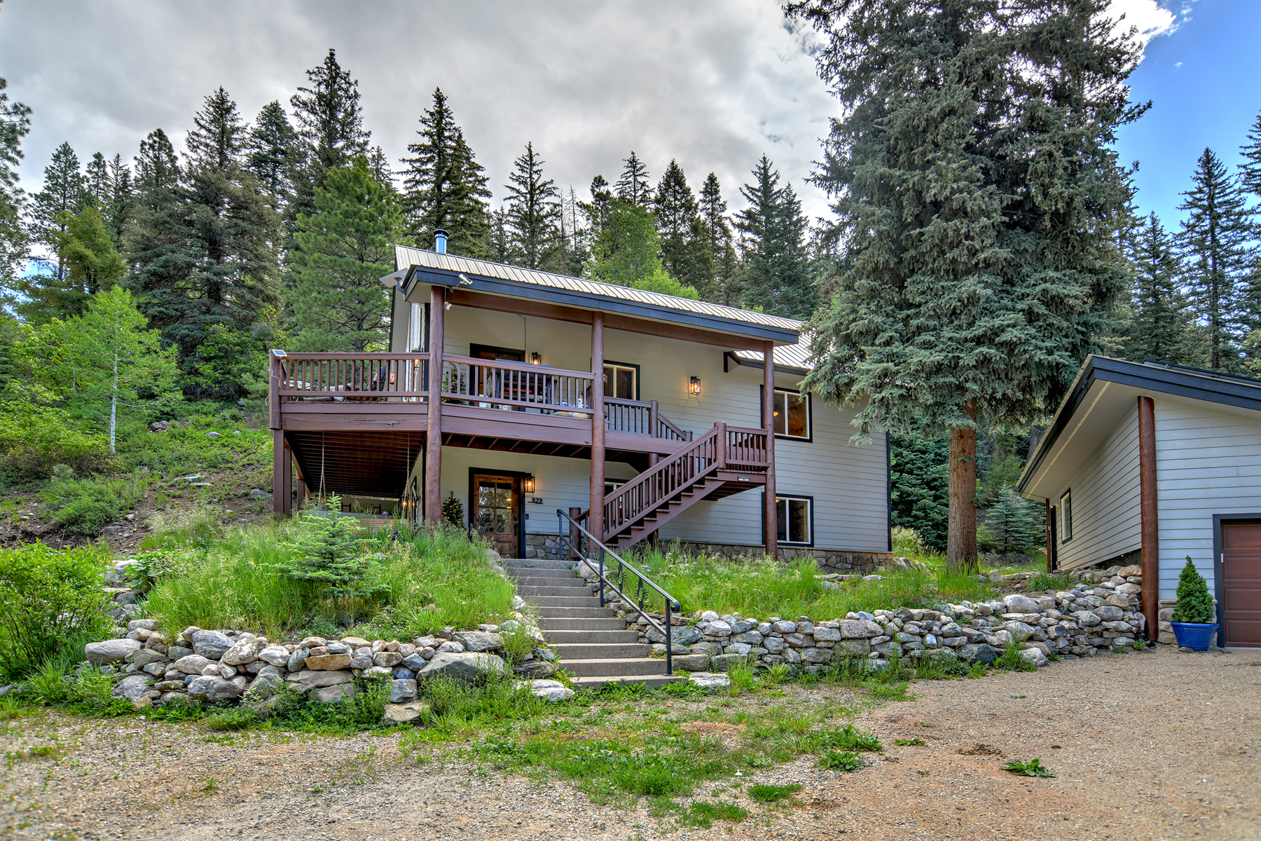 Exterior view of Hillside Hideaway from parking area. 