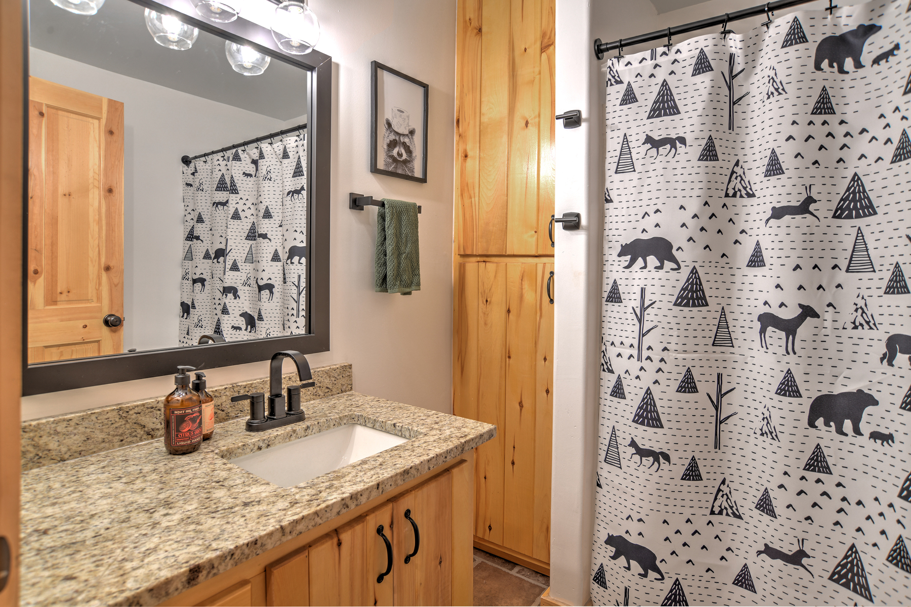Full bathroom with convenient tub/shower combo and modern finishes.