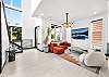 As soon as you enter the home, you are greeted by a designer living room area. 