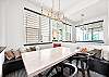 Gather around the dining table and enjoy a meal together. 