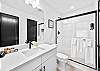 Full bathroom #3: Fresh and functional full bathroom with a walk-in shower and contemporary design.