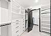 Large walk-in closet leads to the in-house washer and dryer.