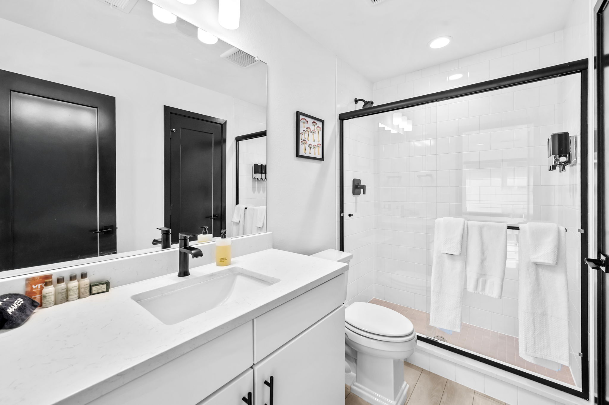Full bathroom #3: Fresh and functional full bathroom with a walk-in shower and contemporary design.