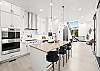 Whip up your favorite meals in this beautifully designed kitchen – includes breakfast bar seating for 3. 