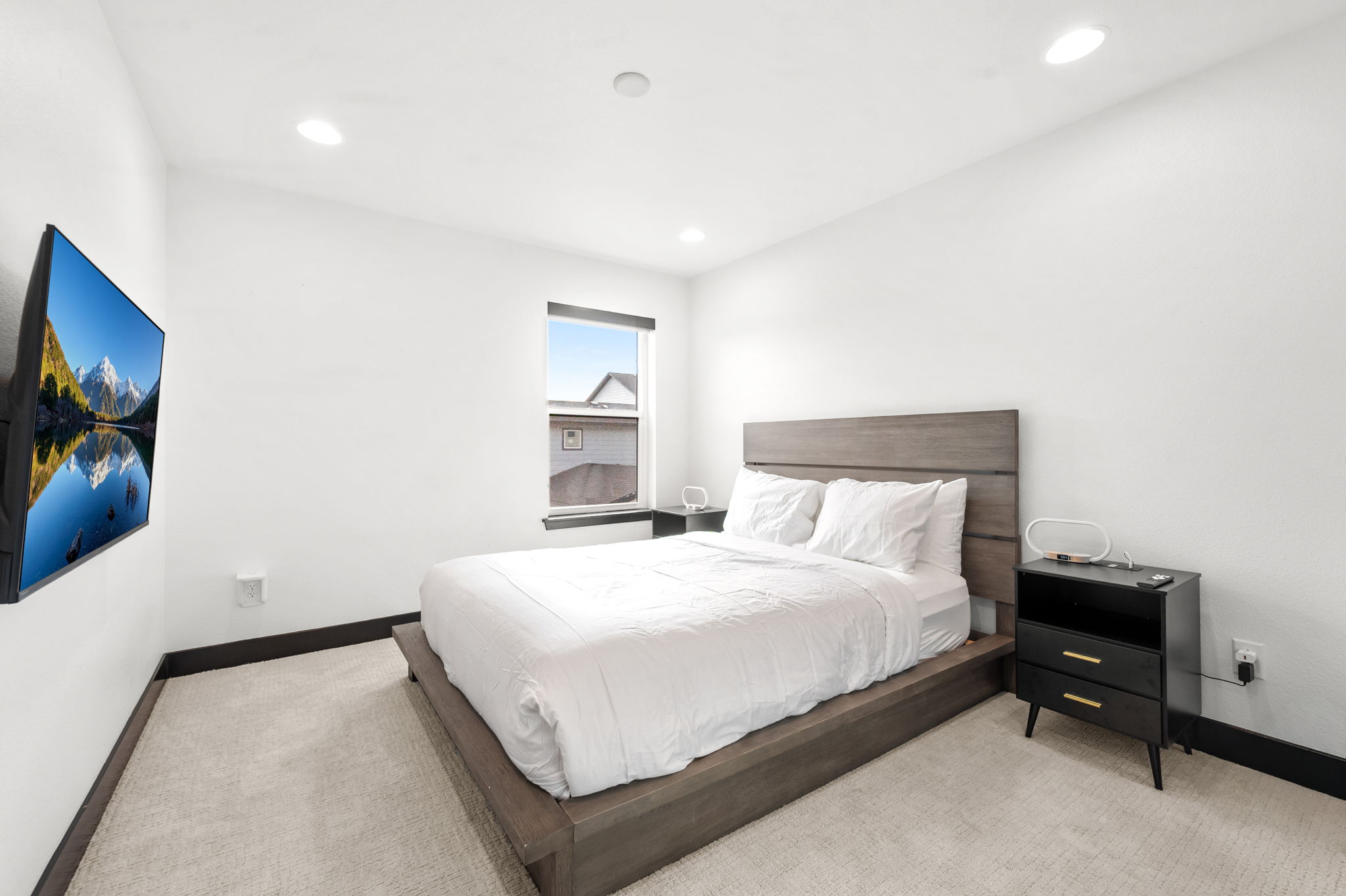 Relax and recharge in this cozy queen bedroom retreat with a smart TV.