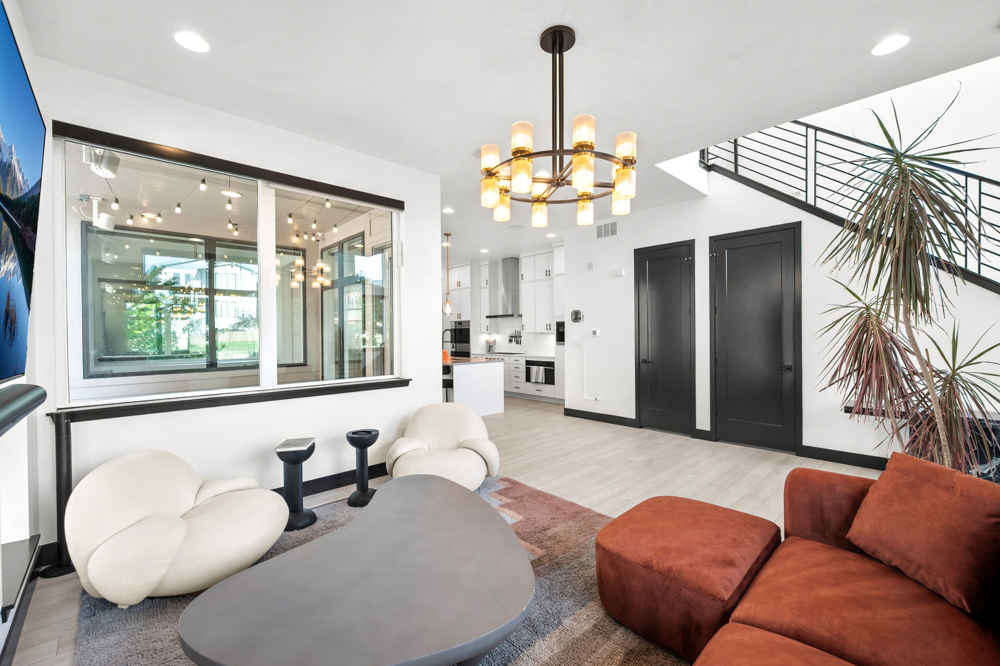 As soon as you enter the home, you are greeted by a designer living room area. 