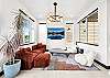 As soon as you enter the home, you are greeted by a designer living room area. 