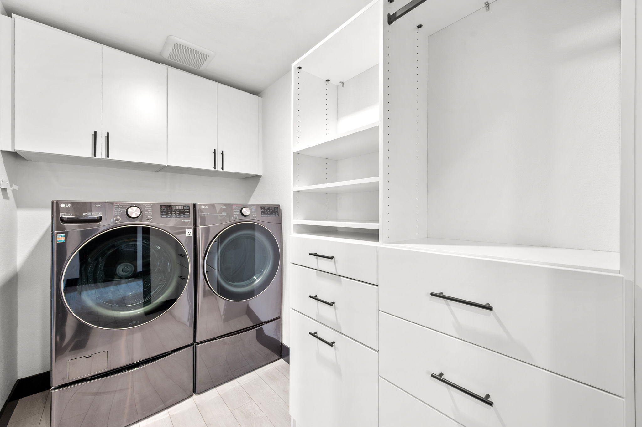 Large walk-in closet leads to the in-house washer and dryer.