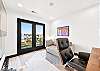 The private office includes a dedicated desk, balcony, and garden view. The teddy sofa also converts to a bed. 