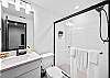 Full bathroom #4: Enjoy the convenience of a walk-in shower in this well-appointed bathroom.
