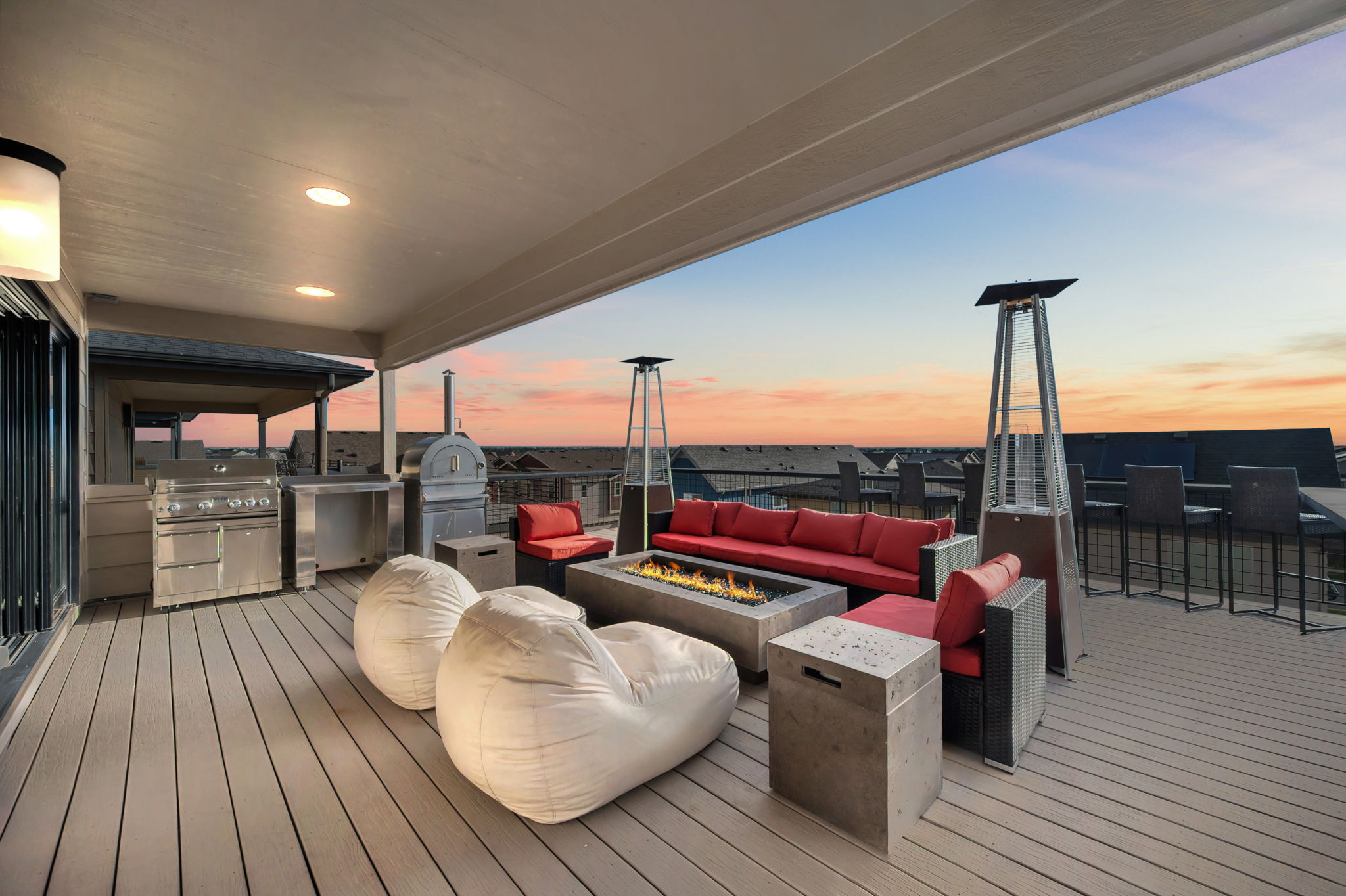Enjoy evenings around the fire pit on the rooftop balcony. 
