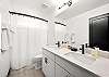Full Bathroom #2: Clean and functional guest bathroom featuring a tub/shower combination.