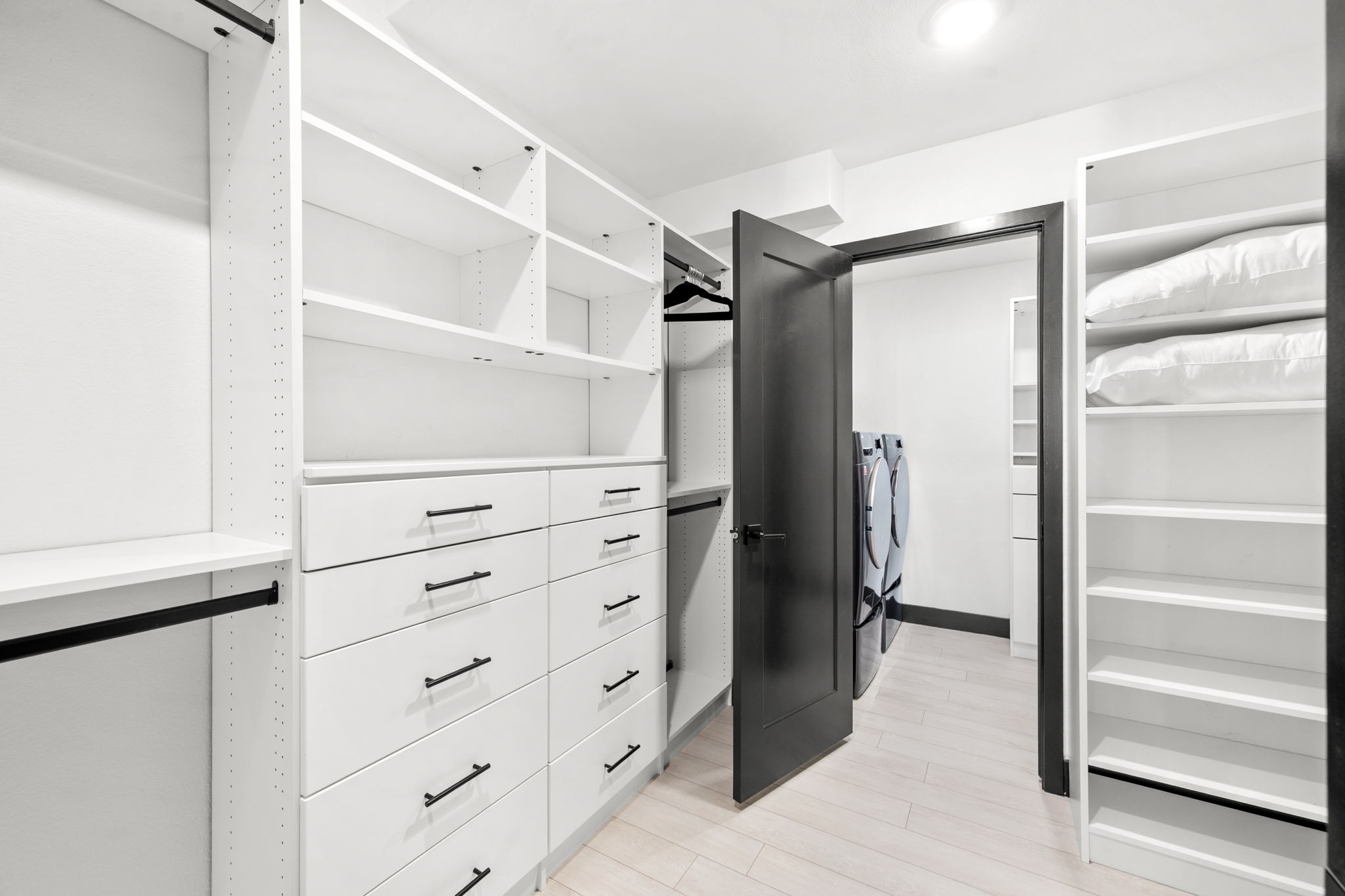 Large walk-in closet leads to the in-house washer and dryer.