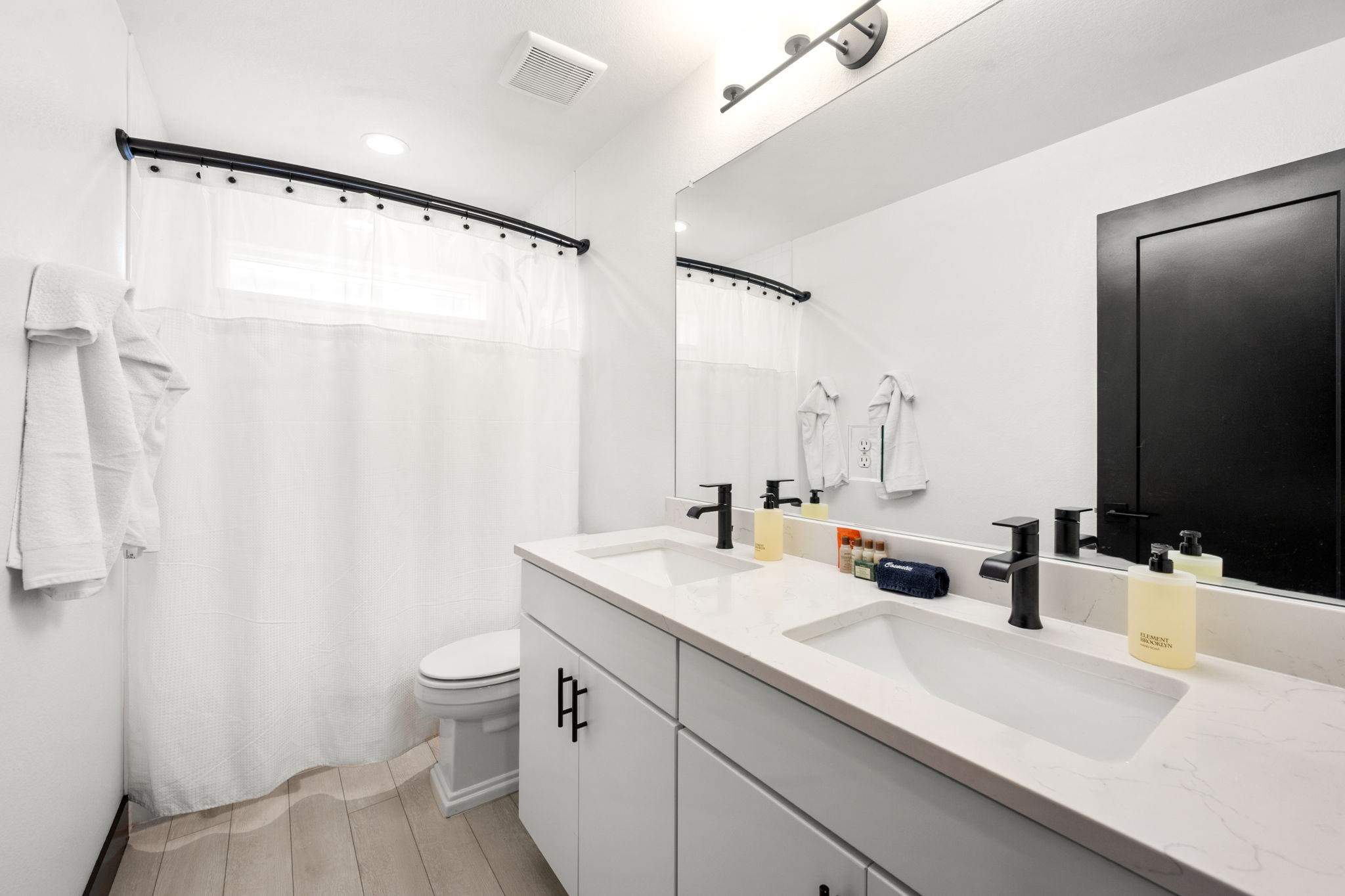 Full Bathroom #2: Clean and functional guest bathroom featuring a tub/shower combination.