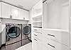 Large walk-in closet leads to the in-house washer and dryer.