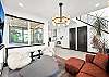 As soon as you enter the home, you are greeted by a designer living room area. 