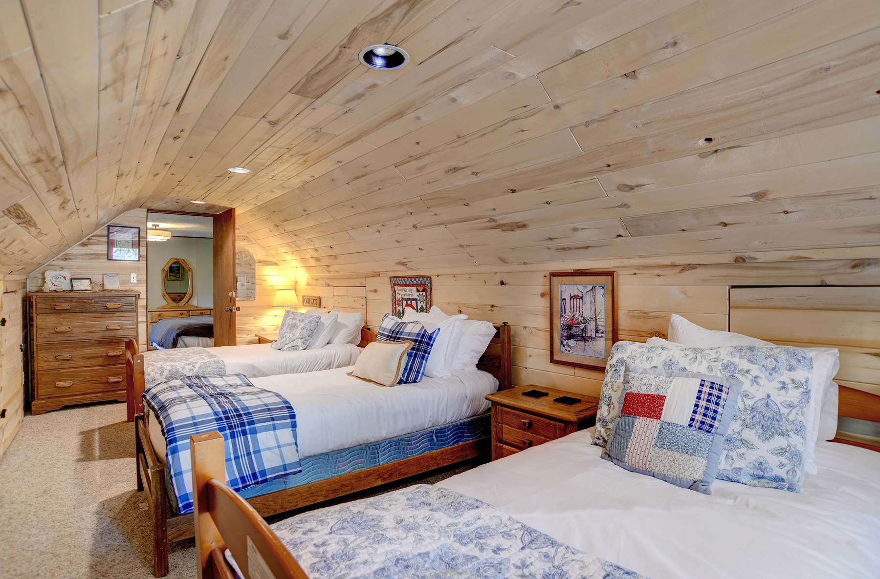 4th bedroom with three twin beds accessible through the king bedroom.