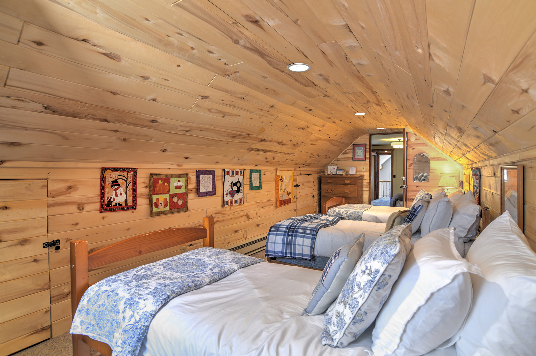 Second-story twin bedroom with three twin beds. Accessible through the king bedroom.
