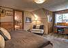 Second-story king bedroom with a remote workstation.  Please note that the 4th bedroom is accessed from this bedroom and also the upper-level deck.