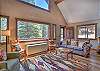 Living room with lots of windows perfect for enjoying the mountain and river views. 
