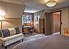 Second-story king bedroom with remote workspace and a twin bedroom accessible from this bedroom. 