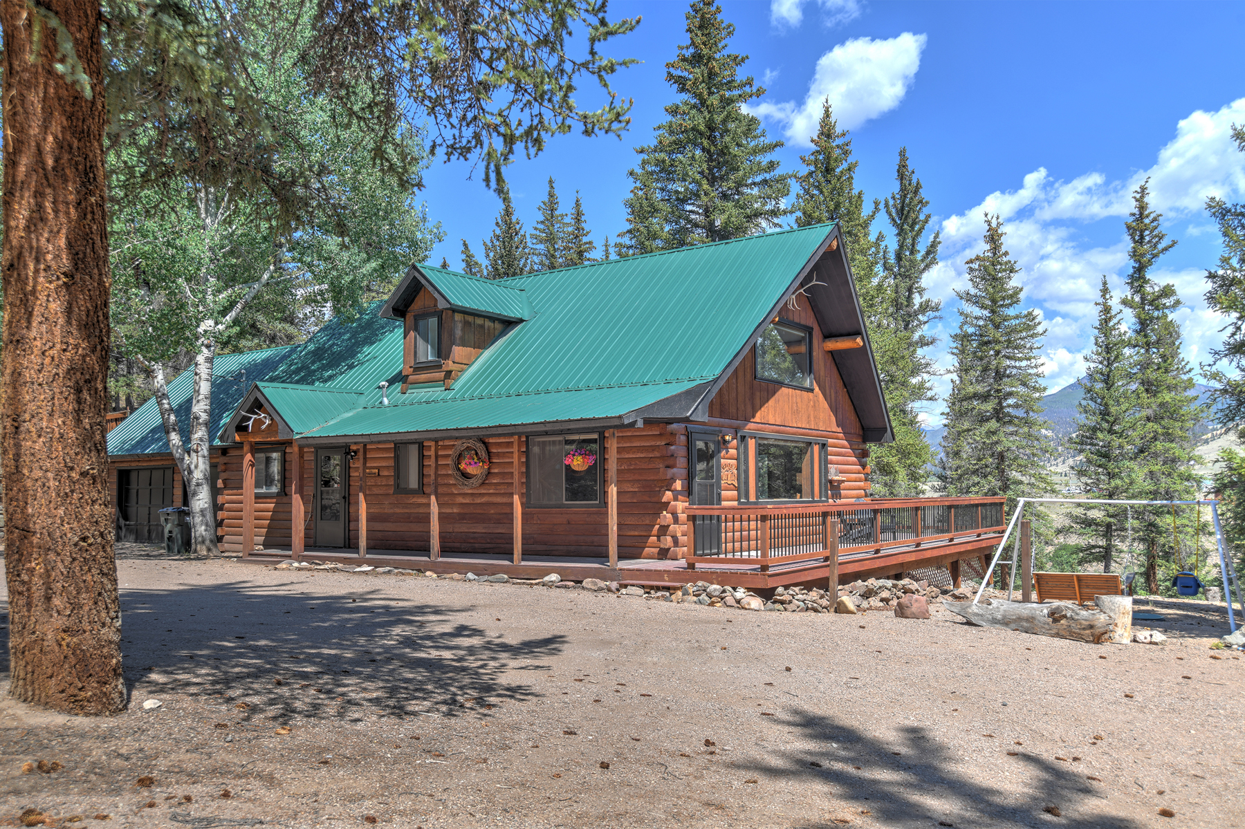 This beautiful mountain cabin sits in the pine trees with the Rio Grande River flowing a short distance away. 