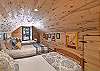 Fourth bedroom with three twin beds, accessible only through the king bedroom on the second story.  To access the upstairs deck, you will have to go through both bedrooms.