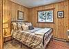 Main level second bedroom with queen bed. 