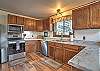 Fully equipped kitchen with dining area.