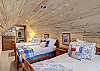 4th bedroom with three twin beds accessible through the king bedroom.