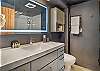 Full bathroom featuring a sleek walk-in shower.