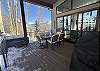 Covered deck off the kitchen - Hot Tub, Dining Table and BBQ Grill