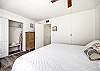 The guest bedroom features a king bed and Smart TV. 