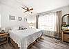 The guest bedroom features a king bed and Smart TV. 