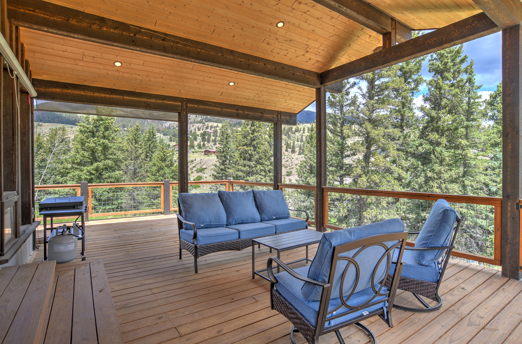 Large deck with mountain and river views. 