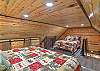 King and queen bed.  Steep stairs to access