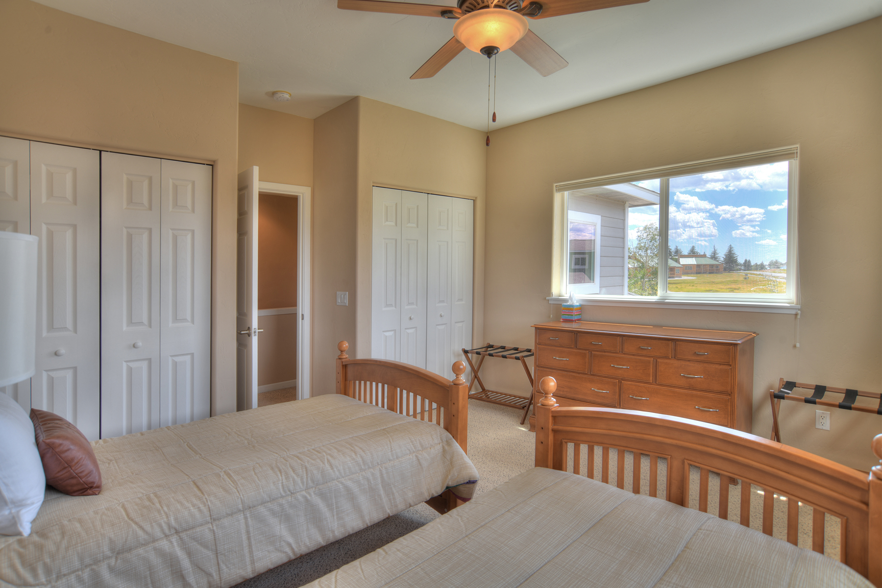 Third bedroom offers two twin beds with mountain views. 
