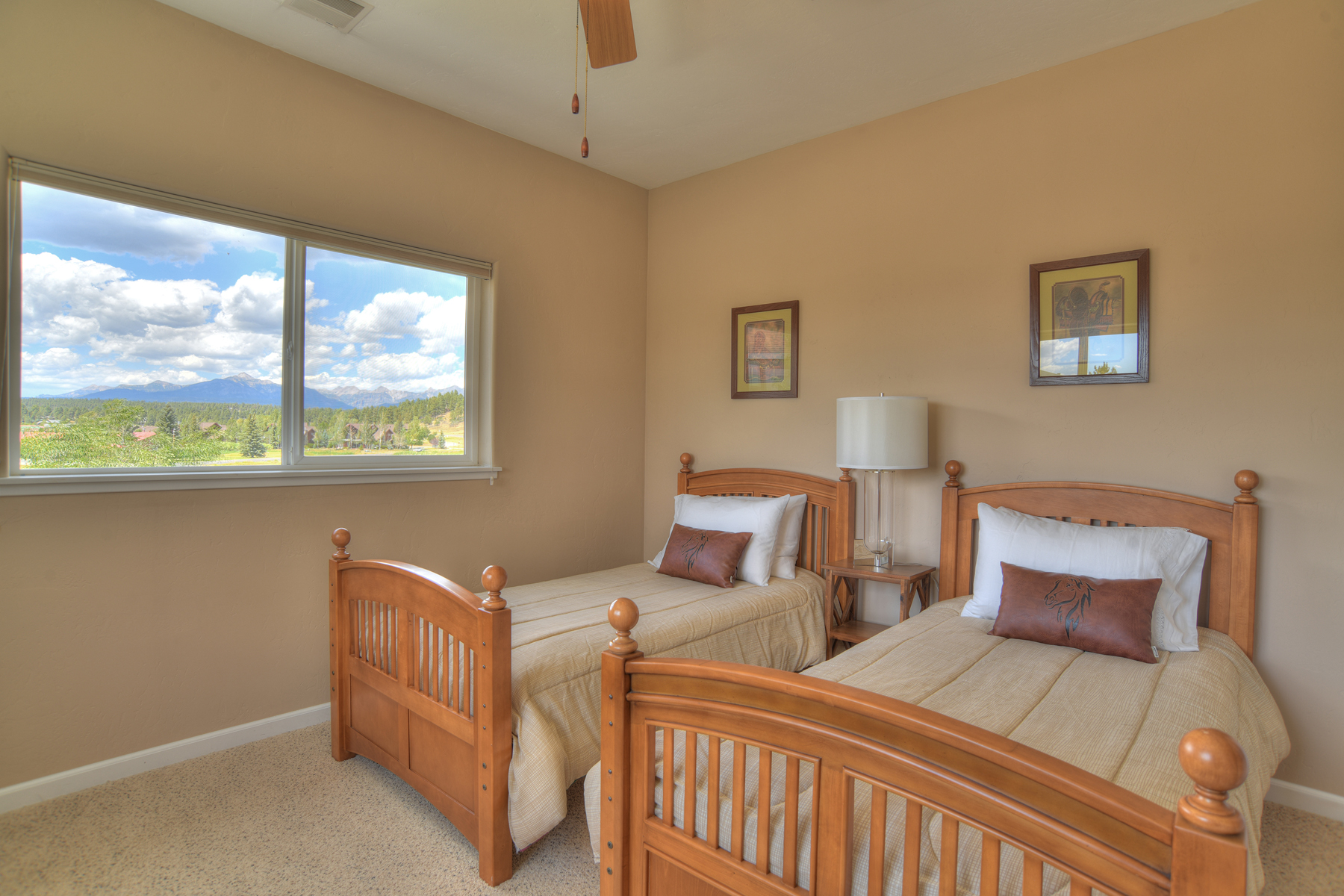 Third bedroom offers two twin beds with mountain views. 

