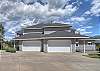 Plenty of space for parking in the driveway and garage.