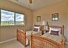 Third bedroom offers two twin beds with mountain views. 
