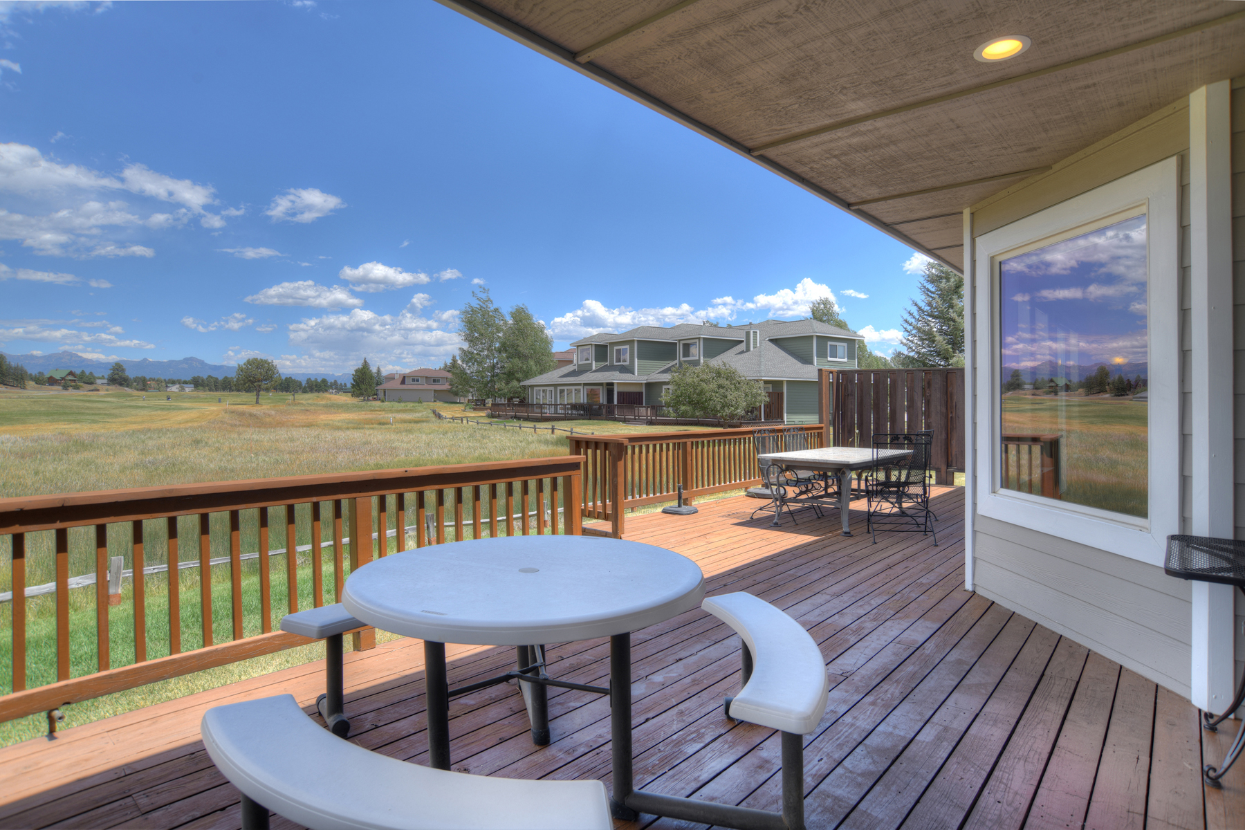 Outdoor entertaining with mountain views, views of the Meadows Course, the 9th hole. Outdoor grill and lots of seating. 