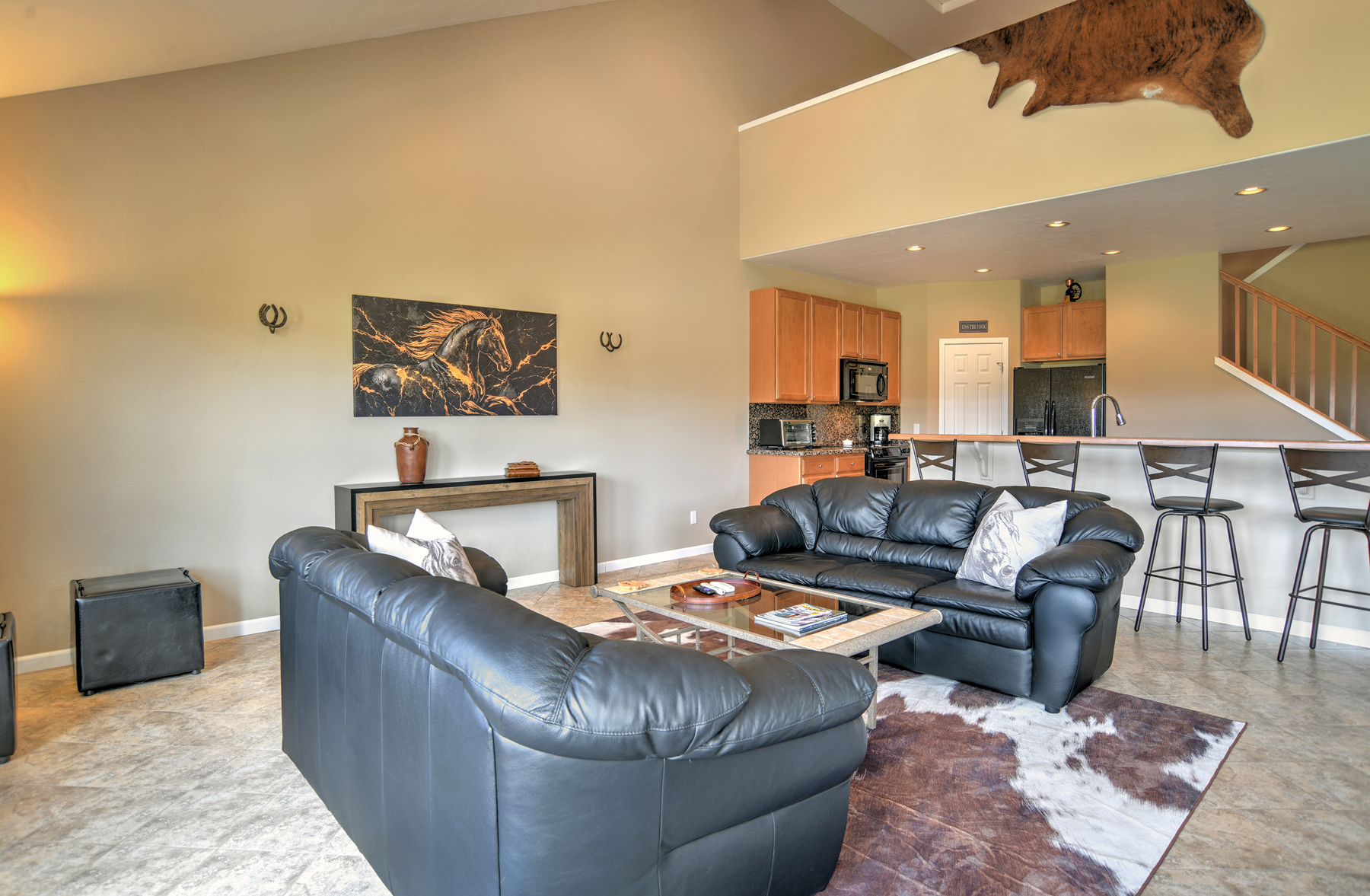 Open-concept living room, kitchen, and dining area. 