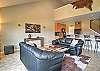 Open-concept living room, kitchen, and dining area. 