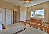 Third bedroom offers two twin beds with mountain views. 
