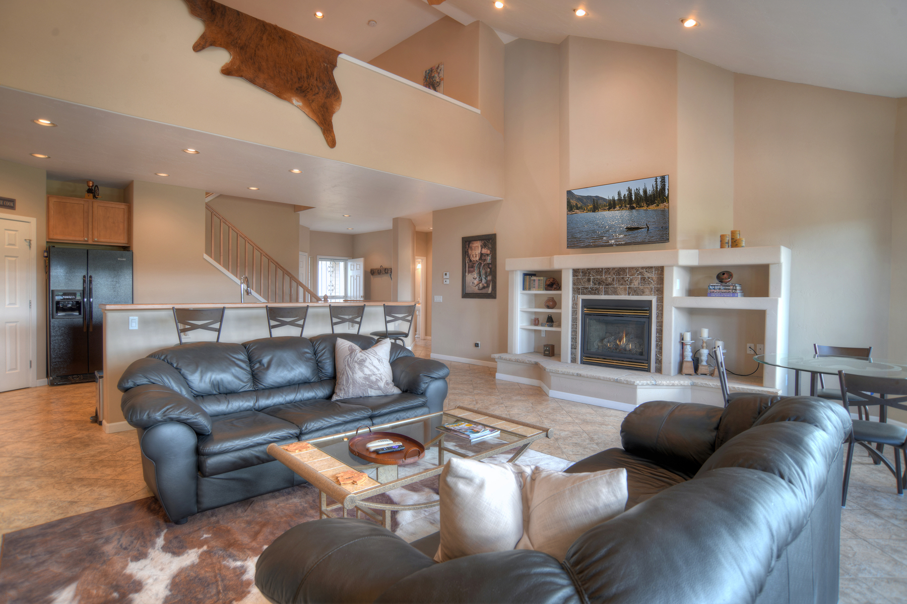 Enjoy the golf course views while snuggled up on the sofa with the fireplace 
