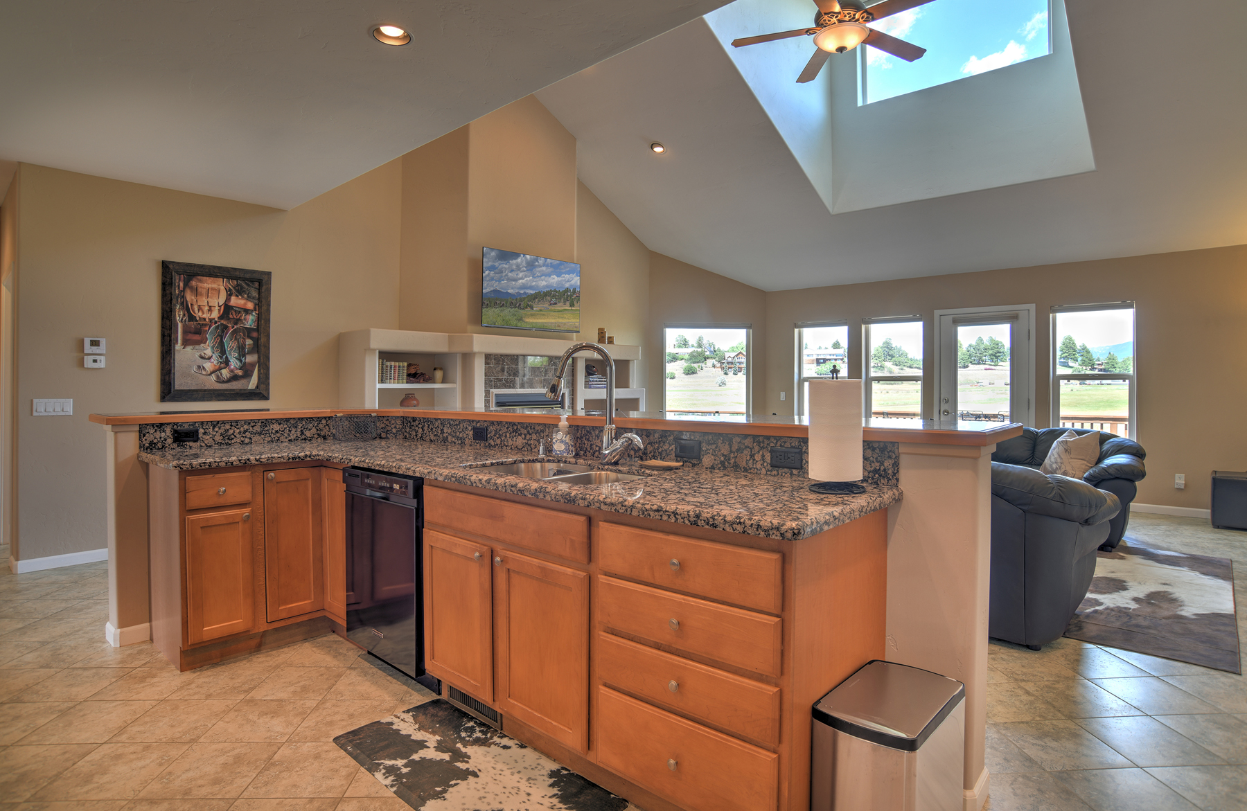 Fully equipped kitchen that opens to the living room, capturing natural light and stunning views. 