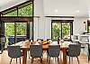 Main floor dining area: 10-seat dining table, 3 barstools